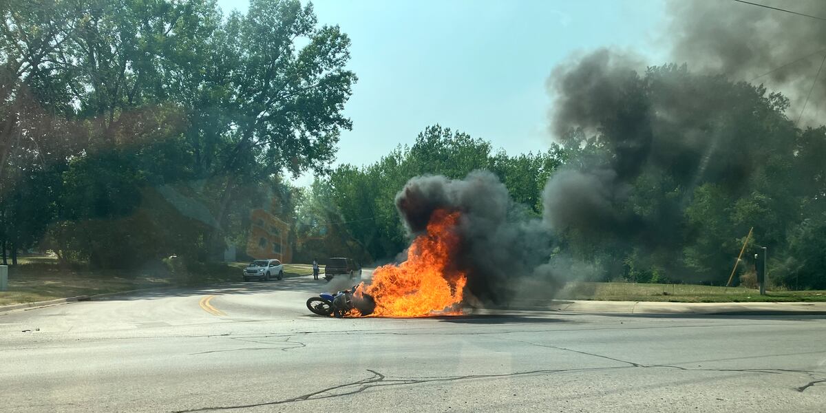 Dirt bike catches fire while being hauled by truck