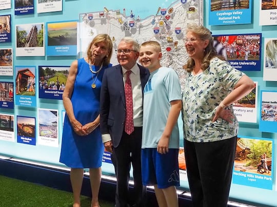 From left, Ohio first lady Fran DeWine and Gov. Mike DeWine take a photo with Miles Armiger,...