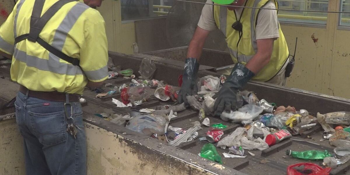 Hand Sorting Solid Solid Hand sorting the city’s recycling